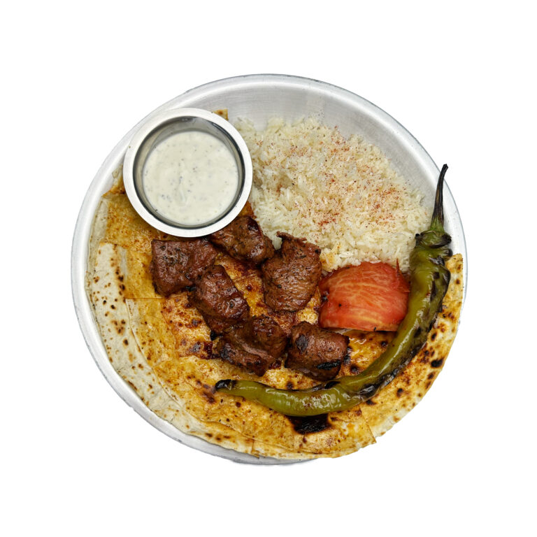 Lamb kebab platter with rice and grilled tomato