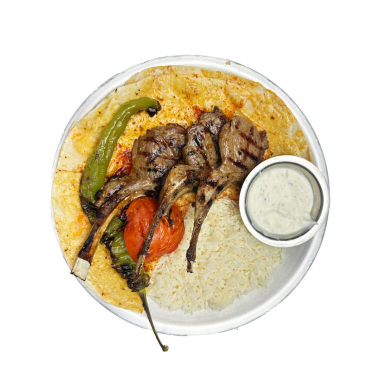 Adana kebab with rice, grilled pepper and tomato